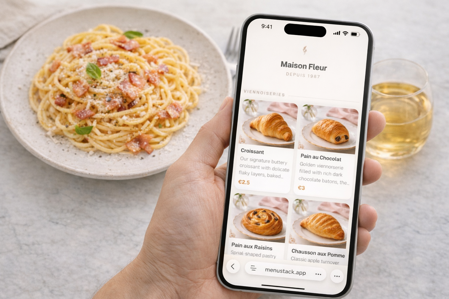 Top-down editorial food photograph of carbonara pasta on a marble surface